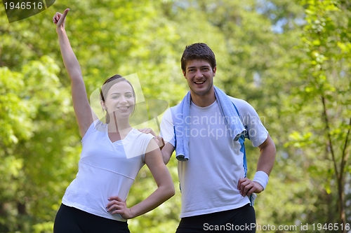 Image of Young couple jogging