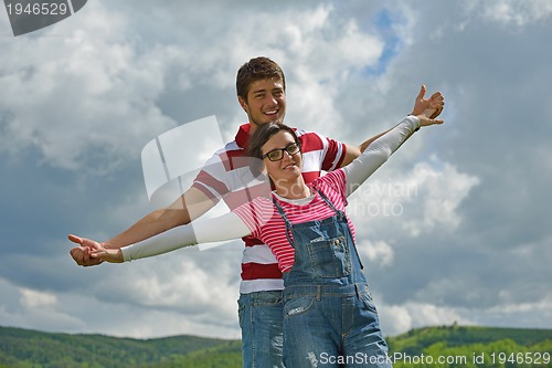 Image of romantic young couple in love together outdoor