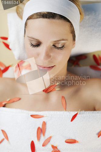 Image of Beautiful young woman in spa