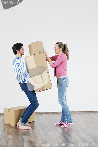 Image of Young couple moving in new home