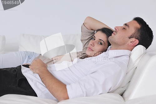Image of happy young couple relax at home