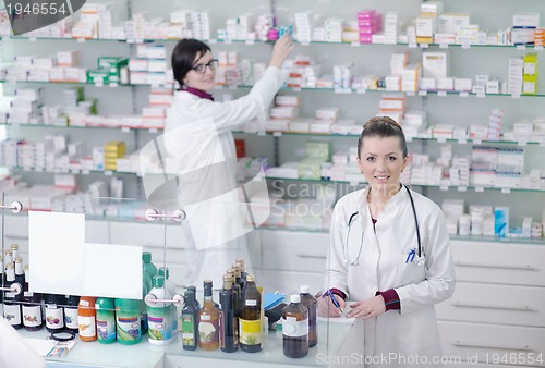 Image of team of pharmacist chemist woman  in pharmacy drugstore