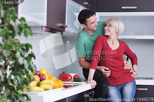 Image of young couple have fun in modern kitchen