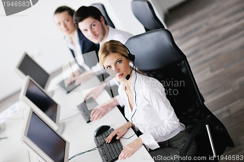 Image of business people group working in customer and help desk office