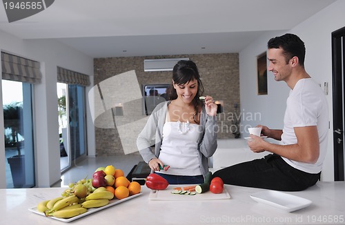 Image of young couple have fun in modern kitchen