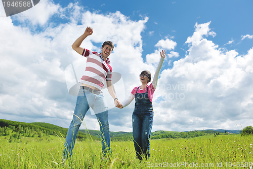 Image of romantic young couple in love together outdoor