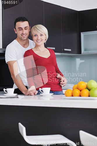 Image of young couple have fun in modern kitchen
