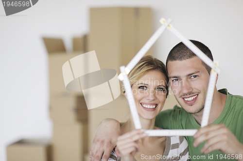 Image of Young couple moving in new home