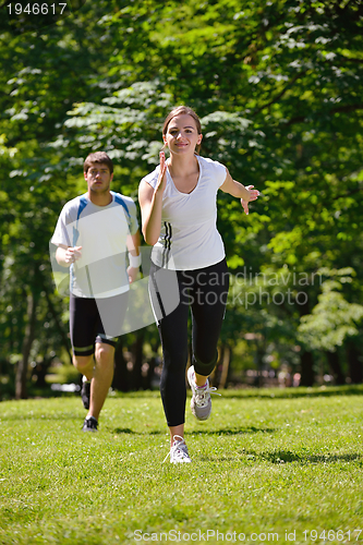 Image of Young couple jogging