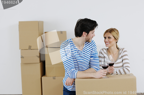 Image of Young couple moving in new house