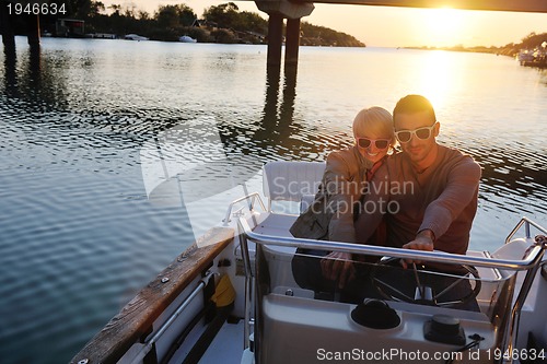 Image of couple in love  have romantic time on boat