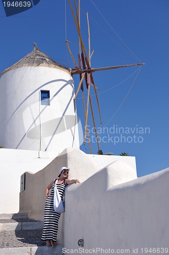 Image of Greek woman on the streets of Oia, Santorini, Greece