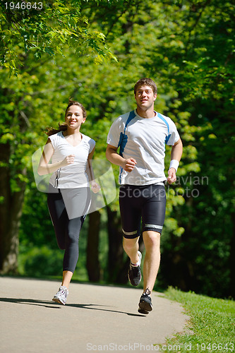 Image of Young couple jogging