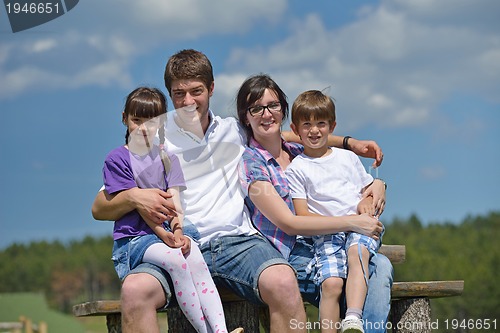 Image of happy young family have fun outdoors