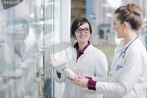 Image of team of pharmacist chemist woman  in pharmacy drugstore