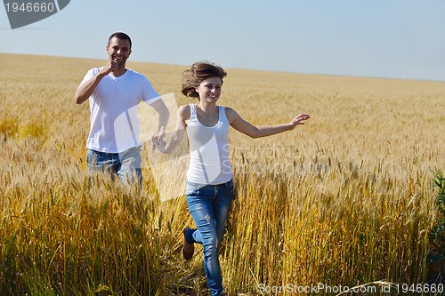 Image of happy couple in wheat field