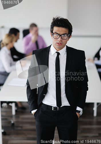 Image of young business man at meeting