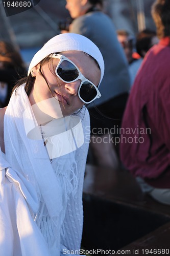 Image of Greek woman on the streets of Oia, Santorini, Greece