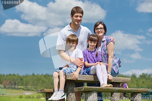 Image of happy young family have fun outdoors