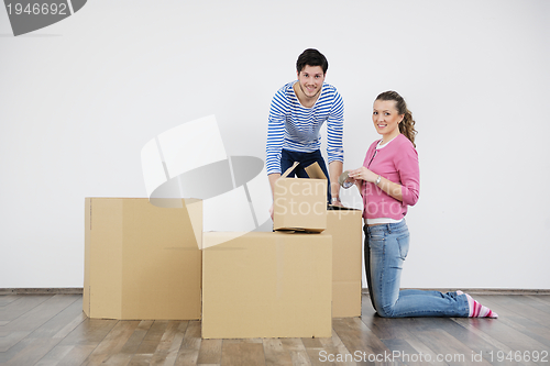 Image of Young couple moving in new home