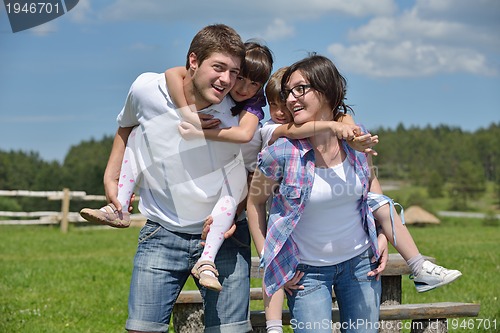 Image of happy young family have fun outdoors