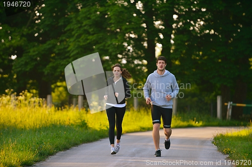 Image of Young couple jogging