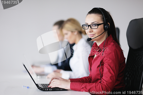 Image of business woman group with headphones