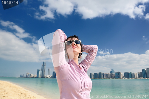 Image of happy tourist woman