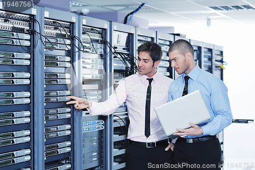 Image of it enineers in network server room