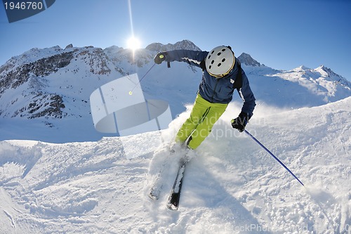 Image of skiing on fresh snow at winter season at beautiful sunny day