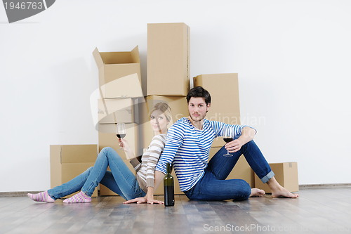 Image of Young couple moving in new house