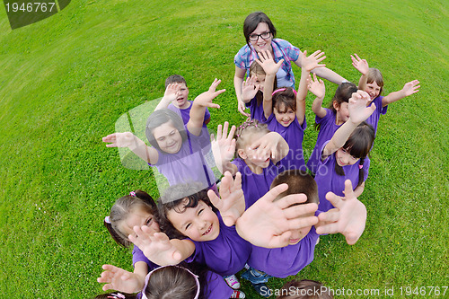Image of happy kids group  have fun in nature