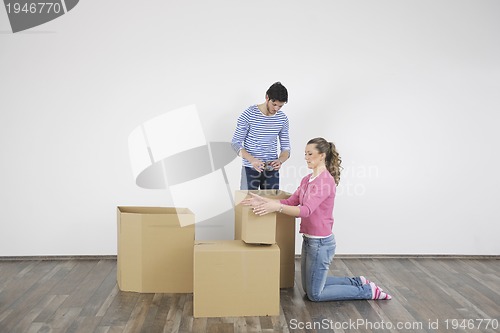 Image of Young couple moving in new home