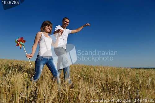 Image of happy couple in wheat field