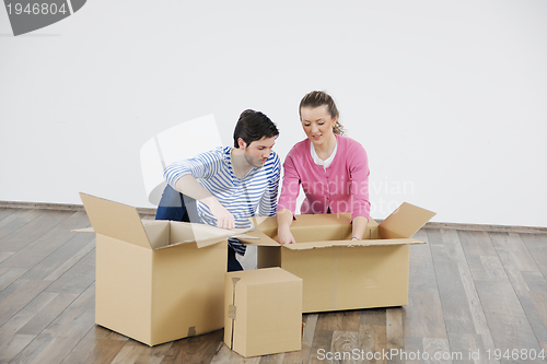 Image of Young couple moving in new house