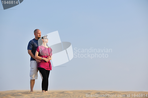 Image of couple enjoying the sunset