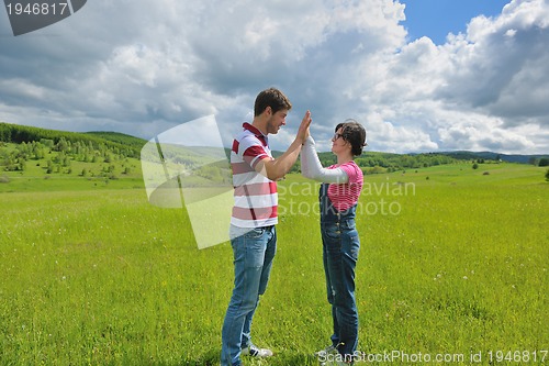 Image of romantic young couple in love together outdoor