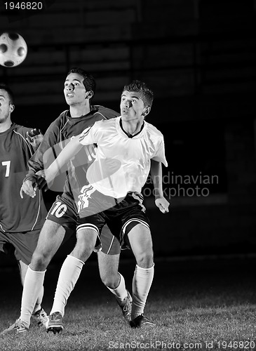 Image of football players in action for the ball