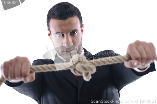 Image of business man with rope isolated on white background