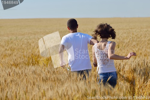 Image of happy couple in wheat field