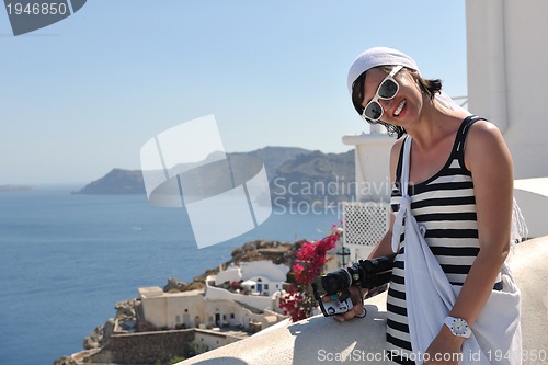 Image of Greek woman on the streets of Oia, Santorini, Greece