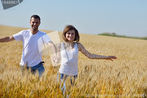 Image of happy couple in wheat field