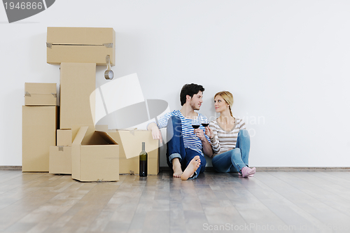 Image of Young couple moving in new house