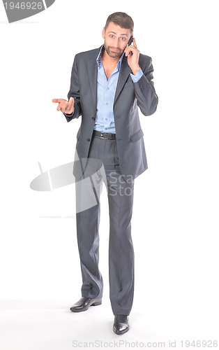 Image of Full length portrait businessman with mobile phone