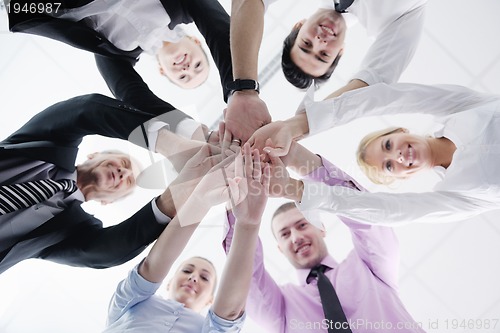 Image of business people group joining hands