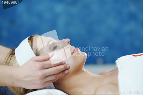 Image of Beautiful young woman in spa