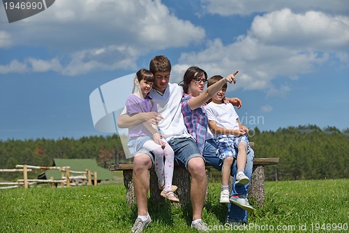 Image of happy young family have fun outdoors