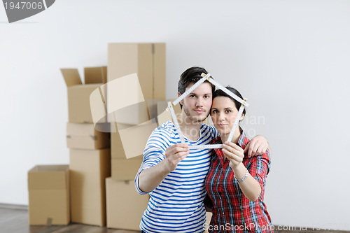 Image of Young couple moving in new house