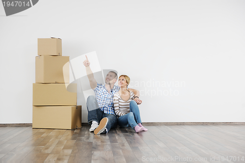 Image of Young couple moving in new house