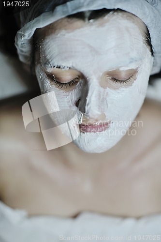 Image of woman with facial mask in cosmetic studio